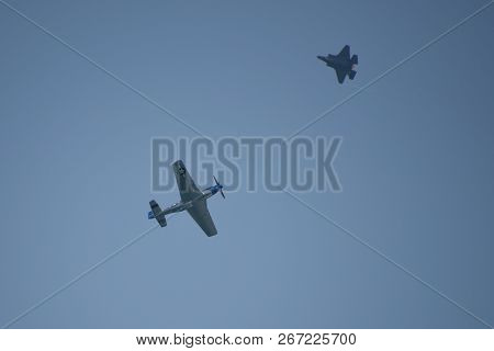 North American P-51 Mustang And Lockheed Martin F-35 Lightning Ii Flying In A Heritage Flight Under 