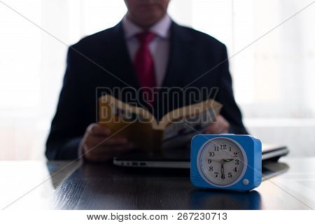 The Concept Of Investing In Yourself And Getting New Knowledge. In The Photo A Businessman In A Tie 