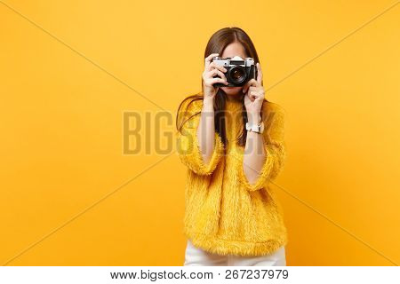 Brunette Young Woman In Fur Sweater Covering Face And Taking Pictures On Retro Vintage Photo Camera 
