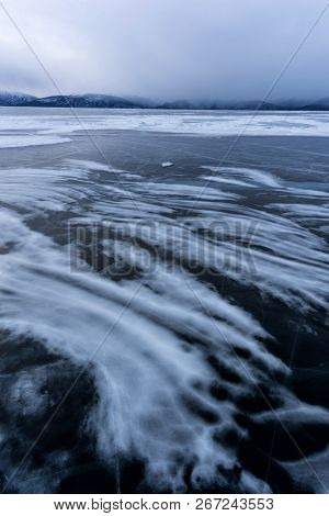 Lake Khubsugul Is Covered With Ice And Snow, Strong Cold, Thick Clear Blue Ice. Lake Khubsugul Is A 