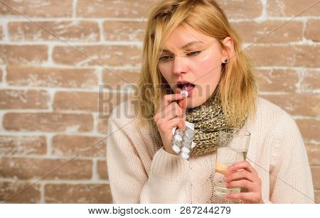 Headache And Fever Remedies. Take Medications To Reduce Fever. Woman Tousled Hair Scarf Hold Glass W