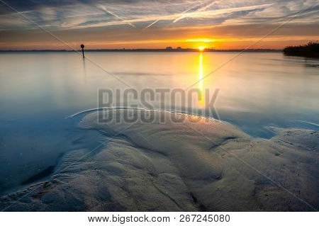 Intense Morning Scene With Beautiful Colors And Velvety Misty Water. Long Exposure Photo With View O