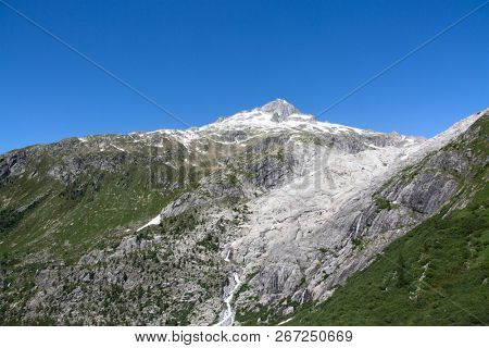 Rhone glacier, source of Rhone river, melting and retreating due to global warming. Rhone glacier is loosing up to 2 meters in length every year.
