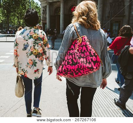Barcelona, Spain - Jun 1 2018: Rear View Of Two Fashionable Adult Women Walking On The Central Aveni