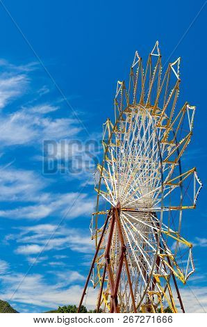 Big Ferris Wheel In Front Of Blue Sky And White Clouds In Pefkohori, Halkidiki, Kassandra, Macedonia