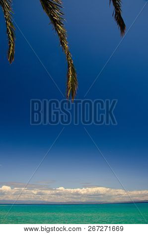 View Of Blue Paradise Water Of Toroneos Kolpos Gulf, Blue Sky And White Clouds Over Sithonia Peninsu