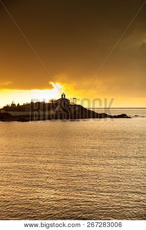 Agios Fokas Near Monemvasia In Stormy Weather Overcast Sky, Sunrise. Small Cemetery On Sea Shore, Ma