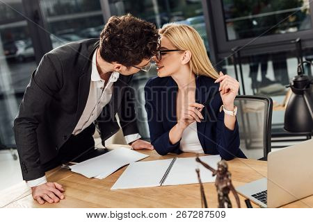 Lawyers Kissing At Workplace With Laptop And Temida In Office
