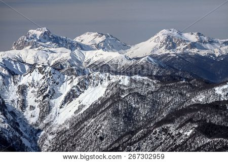 Beautiful Snowy Mountain Peaks Scenic Winter Landscape. Mounts Fisht, Pshekhasu, Oshten In Caucasus 