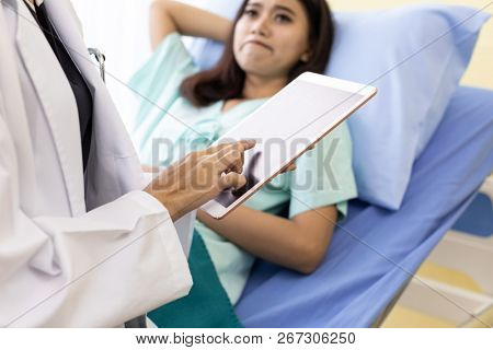 Patient fell worry when Asian Doctor make routine health check in hospital ward