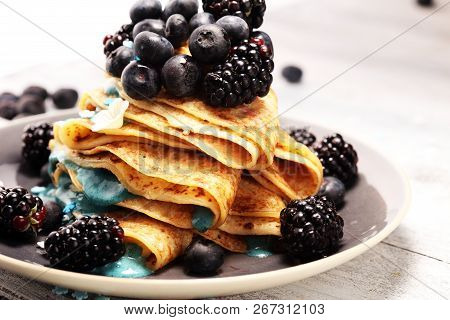 Delicious Tasty Homemade Crepes Or Pancakes With Blackberries,blueberries And Blue Spirulina Nicecre