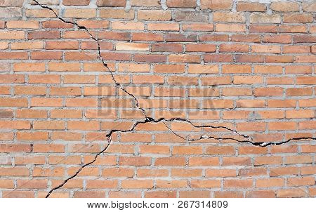 A Brick Building With A Cracked Foundation