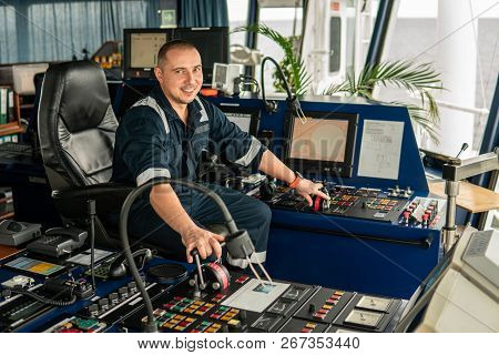 Marine Navigational Officer Is Maneuvering Ship Or Vessel