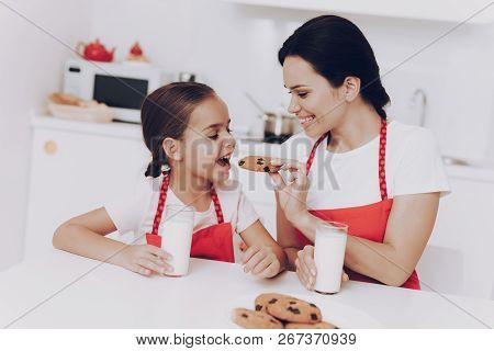 Childhood In Kitchen With Mom Bake A Sweet Cake. Little Girl And Mom Cook. Good Mood And Happy Day W