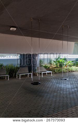 Swings Under A Cinta Costera Road Bridge, Panama City