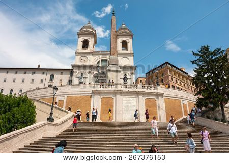 ROME - AUGUST 3: The Spanish Steps, with tourists, seen from Piazza di Spagna on August 3, 2018, Rome.The Spanish Steps are the widest staircase in Europe.
