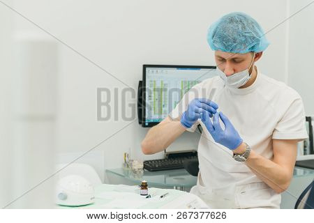 Doctor Used Microscope. Dentist Is Treating Patient In Modern Dental Office. Operation Is Carried Ou