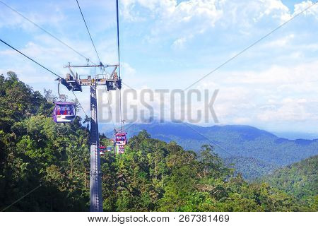 Genting Highlands, Malaysia - December 21 : Tourists Travel On Cable Car Of Genting Skyway. It Is A 