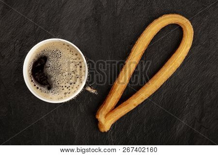 A Photo Of Black Coffee In A Vintage Cup And Traditional Spanish Churros, A Typical Spanish Weekend 
