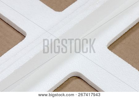 Background Image With Beige Cardboard Paper And Styrofoam Boxes Disgarded As Rubbish. The Concept Of