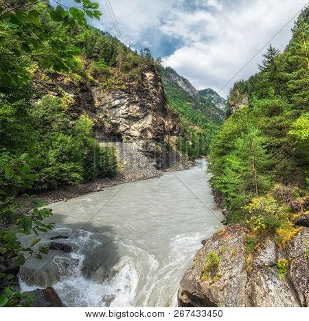Inguri River Between Mountains Rocky Slopes With Trees