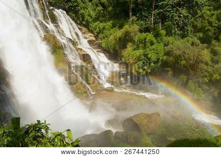 Waterfall With A Rainbow In A Jungle At Wachiran Waterfall In Doi Inthanon National Park In Chiang M