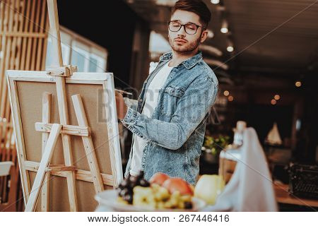 Portrait Of Guy Painting On Easel Still Life. Handsome Professional Caucasian Talanted Painter Artis