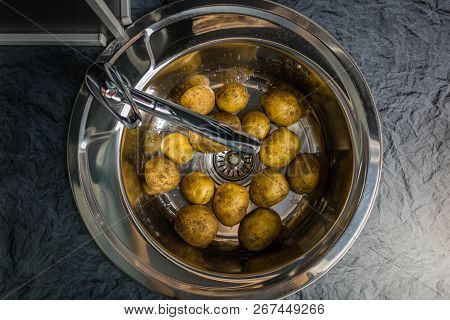 Wash The Raw Potatoes In The Sink. Symbolizes Rural Home Cooking And Garden. Healthy Food Lifestyle.