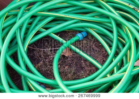 Top View Of Hosepipe On Grass, Minimalistic Conception.