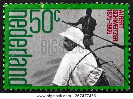 Netherlands - Circa 1975: A Stamp Printed In Netherlands Shows Albert Schweitzer (1875-1065) In Boat