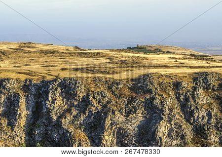Kasakh River Canyon And Plateau Covered With Yellowed Dry Grass Near Ashtarak Town