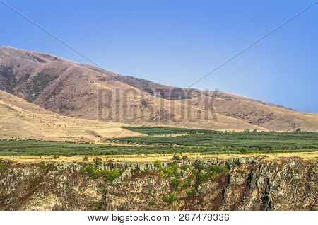 View On Fruit Orchards At The Foothills Of Mount Aragats Over The Kasakh River Canyon Near Ashtarak 