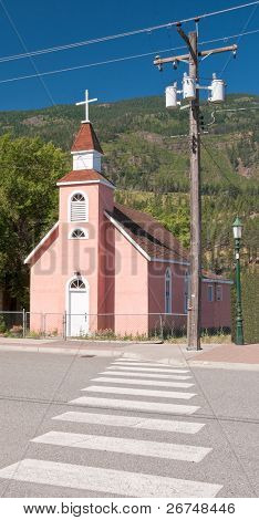 A crosswalk leading to church.