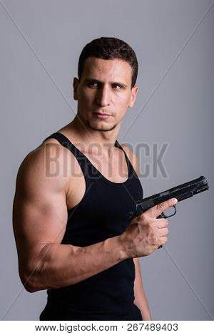 Studio Shot Of Young Muscular Persian Man Thinking While Holding