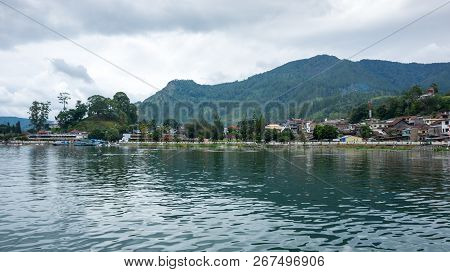 Lake Toba Is A Large Natural Lake Occupying The Caldera Of A Supervolcano, Located In The Middle Of 