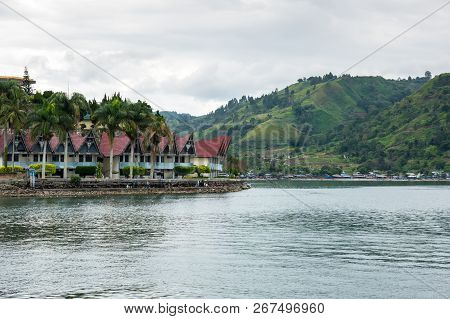 Lake Toba Is A Large Natural Lake Occupying The Caldera Of A Supervolcano, Located In The Middle Of 