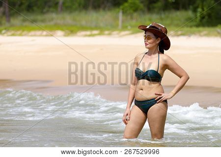 Woman Show Shape Sex Symbol With Bikini Hat And Wave On Beach At Bang Beot Beach, Chumphon Province 