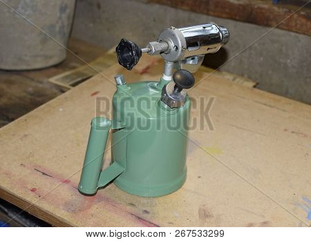 Blowtorch, General View. Blowtorch With A Green Tank