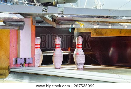 Pinsetter In The Bowling Alley. Pinsetter Installed Pins. A Game Of Bowling