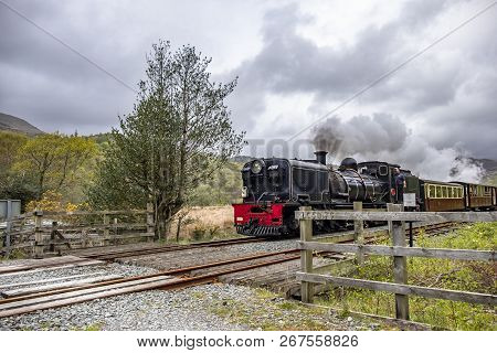 Ffestiniog, Wales - May 03 2018: Ffestiniog Steam Railway Passing By In Snowdonia National Park, Wal