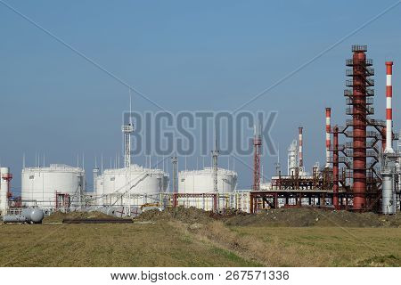 Distillation Columns, Pipes And Other Equipment Furnaces Refinery. The Oil Refinery. Equipment For P