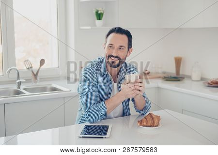 Good-looking Cheerful Brunet Hair Man In Checkered Casual Trendy Shirt Enjoy Moment Look Aside Sit O