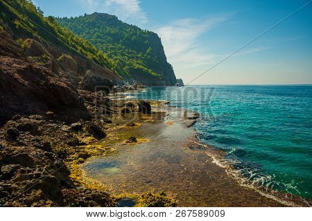 Beautiful Turquoise Sea And The Rocks Near The Cleopatra Beach. Alanya, Antalya District, Turkey, As