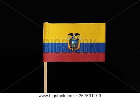 A National Flag Of Ecuador On Toothpick On Black Background. A Horizontal Tricolor Of Yellow, Blue A