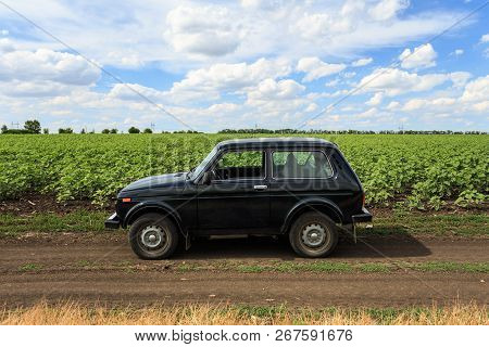 Dnipropetrovsk Region, Ukraine - July 08, 2017: Vaz Niva Blue-green Color On The Dirt Road Near The 