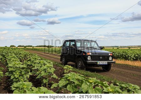 Dnipropetrovsk Region, Ukraine - July 08, 2017: Vaz Niva Blue-green Color On The Dirt Road Near The 