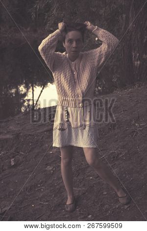 Aggressive Depressive Woman With Eyes Staring At The Shore Of A Forest Lake.