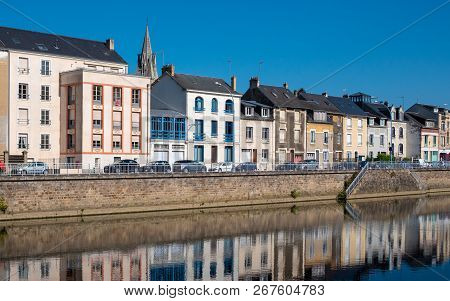 Buildings Are Reflected On The Sarthe River In The City Of Le Mans In Western France. Le Mans Is An 