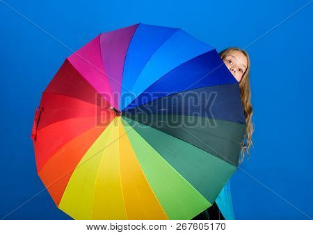 Girl Cheerful Hide Behind Umbrella. Colorful Umbrella Accessory. Weather Forecast Concept. Stay Posi