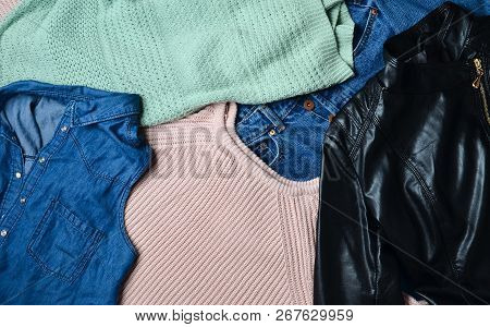 A Lot Of Different Women's Clothing. Sweater, Jeans Shirt, Jeans, Leather Jacket. Second Hand.